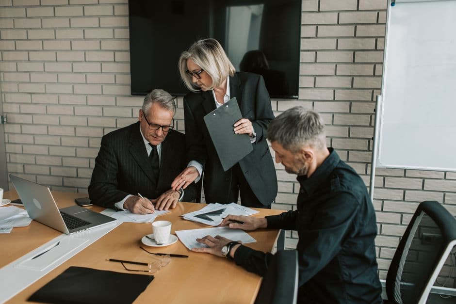 Business executives discussing strategy in a modern boardroom.
