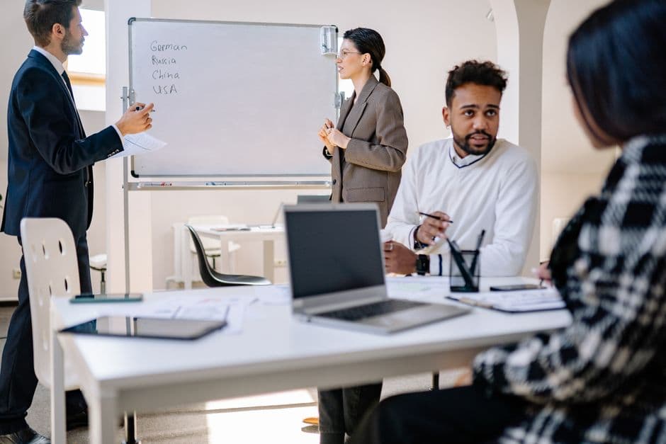 Diverse group of professionals in a collaborative team meeting.