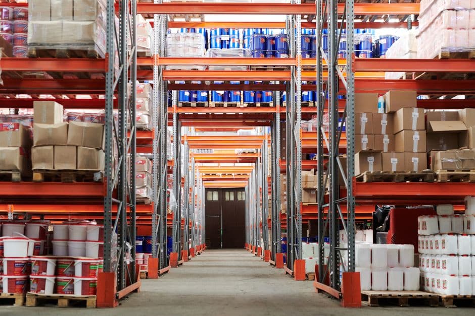 E-commerce warehouse fulfillment with packages and workers.